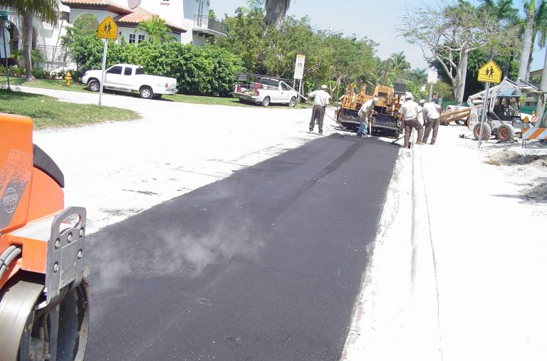Men working on building an asphalt road